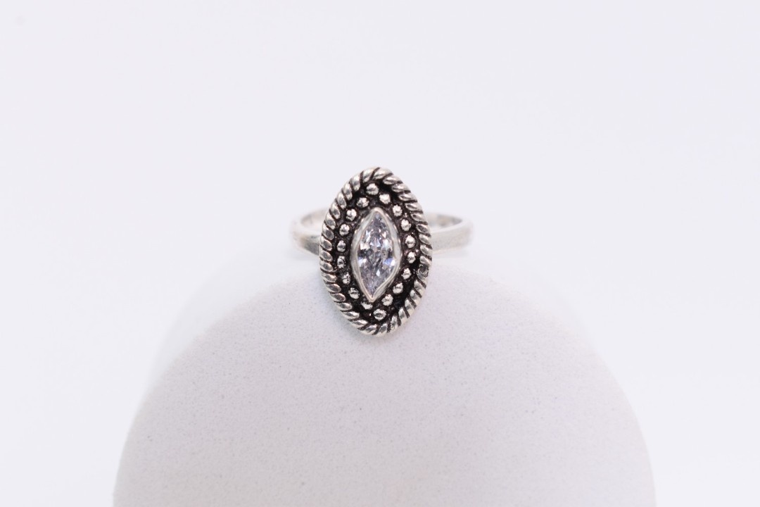 A pair of silver toe rings with white cutstones set in a marquise shape.