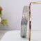 A set of silver bangles adorned with rows of sparkling CZs.